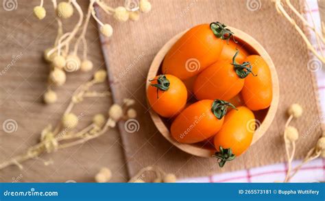 Orange Cherry Tomatoes In Wooden Bowl Fresh Organic Vegetable Stock