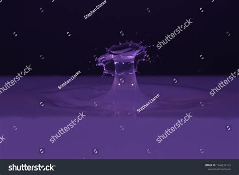 Water Droplet Hitting Water Splash Art Stock Photo 1340224163