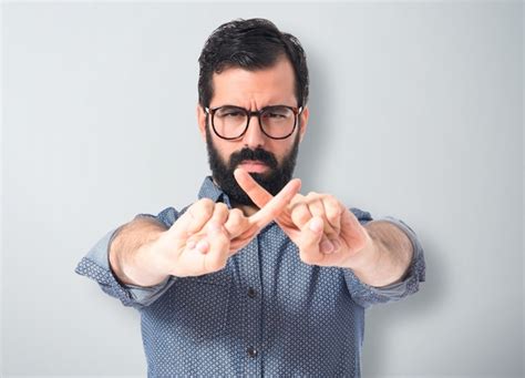 Premium Photo Young Hipster Man Doing No Gesture