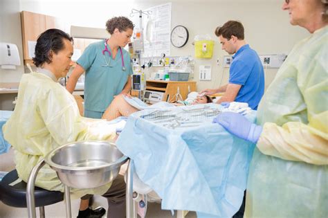 Doctor Operating Pregnant Woman During Delivery Stock