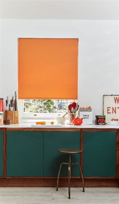 We Love How These Bold Orange Roller Blinds Match The Accessories In
