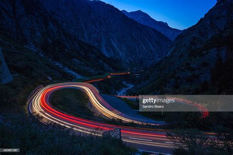 Mountain Road At Night With Car Light Trails Stock Photo Getty Images