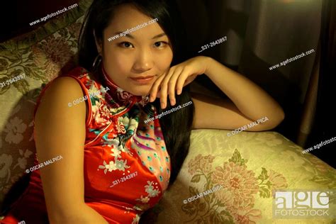 Portrait Of A Beautiful Young Chinese Girl Wearing A Traditional Chinese Dress Qipao Stock