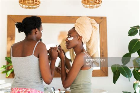 Two Young African Women Using Eye Patch High Res Stock Photo Getty Images