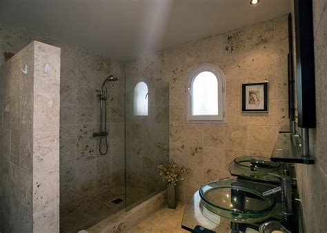 Brighten a beige travertine tile bathroom with a modern coastal look! Modern Travertine Tile Bathroom | HGTV