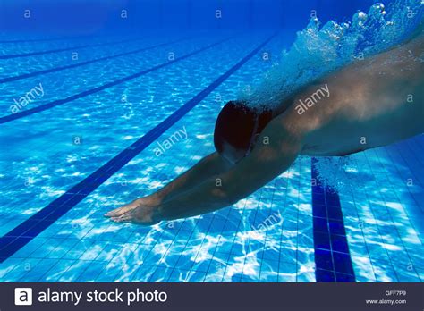Jumping Into The Swimming Pool Underwater Male Swimmer At The Swimming