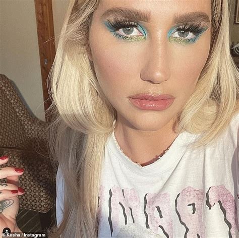 kesha sends temperatures soaring as she flashes her ample assets in lace bra and plunging white