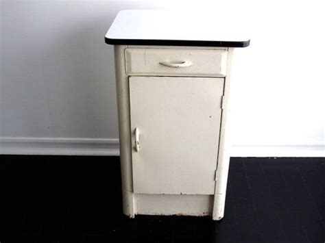 A vintage white metal cabinet. Vintage White Metal Cabinet with an Enamel Top ...