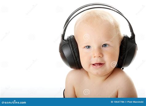 Bebé Sonriente Con El Auricular Foto De Archivo Imagen De Comienzo