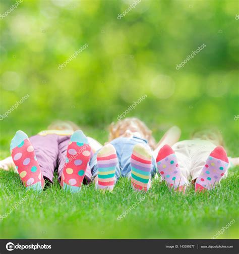 Happy Children Playing Outdoors Stock Photo By ©yaruta 143399277