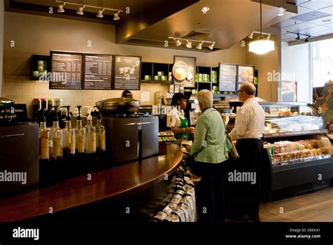 Customers ordering drinks at Starbucks counter - USA Stock Photo