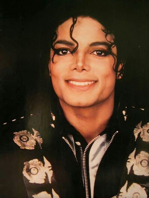 Michael Jackson Is Smiling For The Camera With His Hair In Curls And