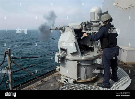 Gunners Mate Fires A Mark 38 Mod 2 Machine Gun During A Live Fire