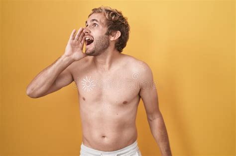 Caucasian Man Standing Shirtless Wearing Sun Screen Shouting And Screaming Loud To Side With