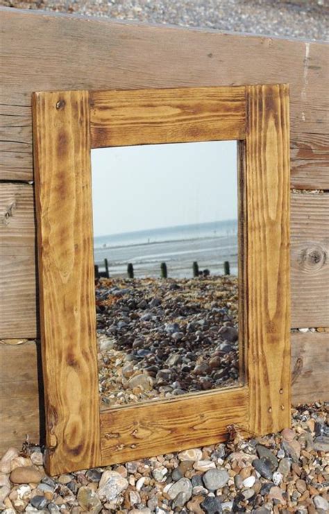 Buying a framed mirror can cost several hundred dollars or we installed two large mirrors during our home gym remodel with the plan to add a wood frame. Wood Pallet Mirror Frame | Pallets Designs