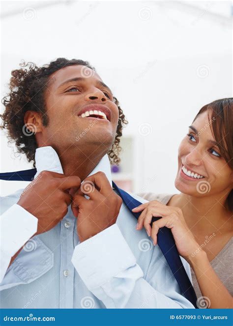 Young Woman Helping Her Boyfriend With His Tie Stock Image Image Of