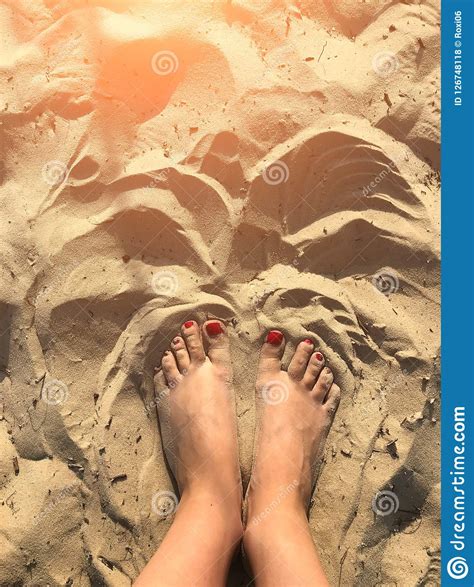 Woman Tanned Legs On Sand Beach Travel Concept Stock Photo Image Of