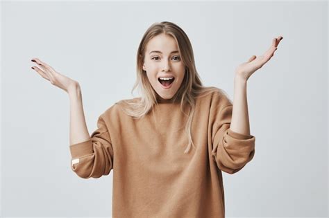 Free Photo Excited Young Female With Blonde Hair Exclaiming Positive