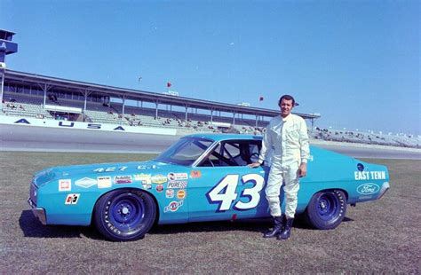 Richard Petty Poses With His No 43 Car At Daytona Ford Racing