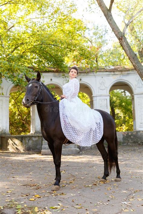 Beautiful Bride In A Dress Riding A Horse Stock Photo Image Of Adult