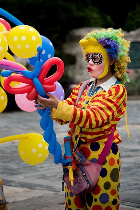 Selling The Balloons A Woman Disguised As A Clown Selling The Balloons