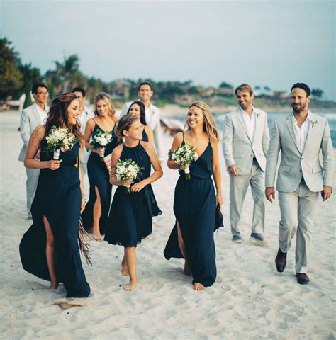 Beach Wedding Bridesmaids In Navy Blue Dresses And Groomsmen In Grey