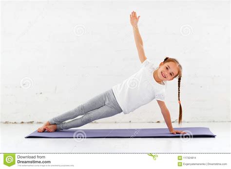 Child Girl Doing Yoga And Gymnastics In Gym Stock Photo Image Of