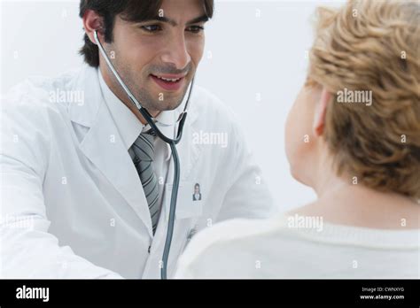 Doctor Examining Patient Using Stethoscope Stock Photo Alamy