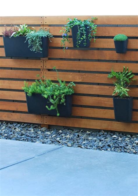 DIY Wood Slat Garden Wall with Planters | Remodelaholic