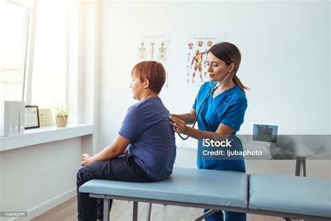 Female Nurse Checks Patients Vital Signs Stock Photo Download Image