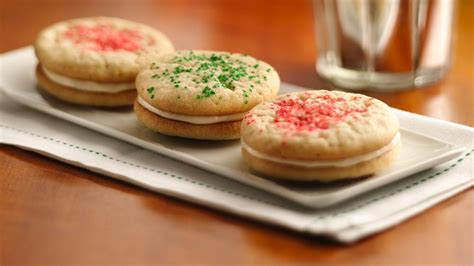 Bake 11 to 14 minutes or until edges are light golden brown. Christmas Sugar Cookie Sandwich Cookies recipe from ...