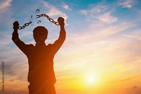 Silhouette Image Of A Businessman With Broken Chains In Sunset Stock Photo Adobe Stock
