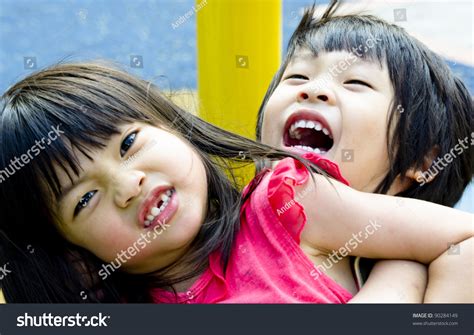 Asian Sibling Brother And Sister Play Wrestling Stock Photo 90284149