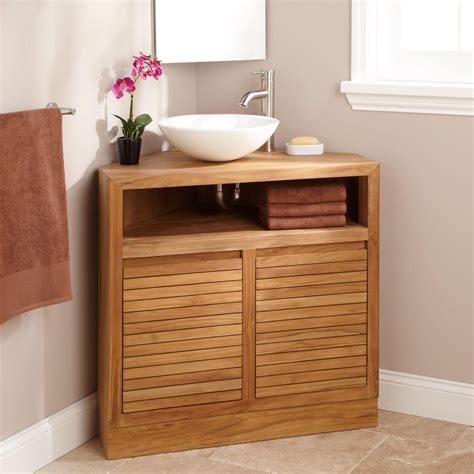 They usually have a small cabinet or storage beneath where plumbing can be accessed. 34" Cuyama Teak Corner Vanity - Bathroom