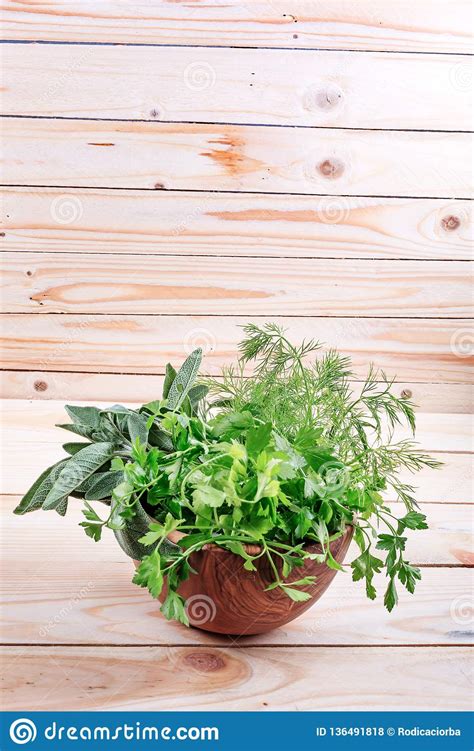 Fresh Herb Leaves Variety In Wood Bowl On Table Stock Photo Image Of
