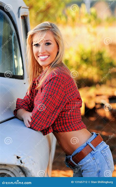 Country Girl In A Good Mood Walks In A Rape Field Royalty Free Stock