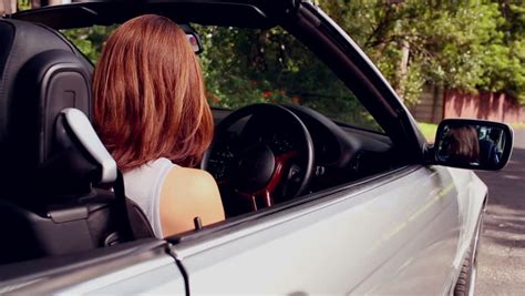 Romantic Couple Making Out In The Back Seat Of Silver Convertible Stock