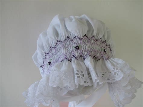 Hand Smocked White Baby Bonnet With Purple And Lavender