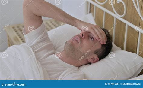 Scared Young Man Waking Up From Nightmare In Bed Stock Image Image Of