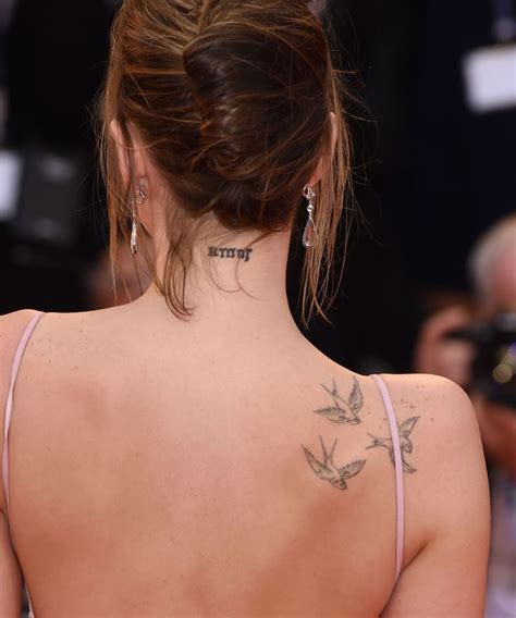 Dakota Johnson Has The Word “amor” Tattooed On The Back Of Her Neck In