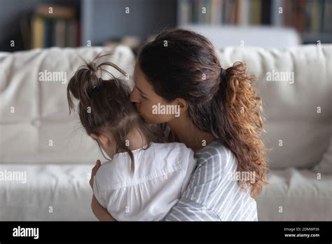 Loving Mom Hug And Cuddle Small Daughter Stock Photo Alamy