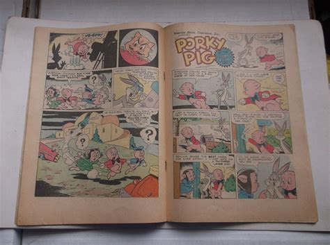 Dell Four Color Porky Pig In Roaring Rockets Wbugs Bunny Cover