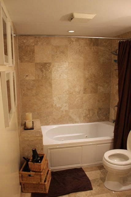 Our fave bathroom tile design ideas. Tile tub wall matches floor: color scheme browns, tans and ...
