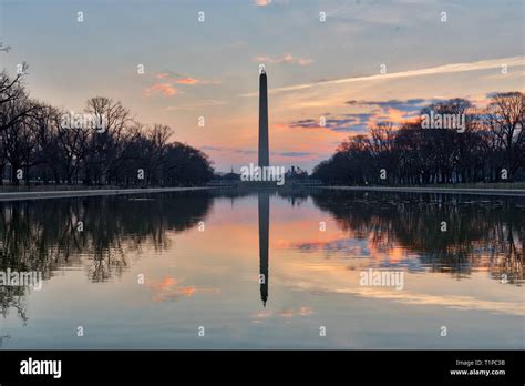 View Of Washington Monument At Sunrise With Reflection On The Lincoln
