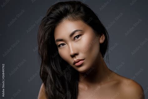 Beautiful Asian Woman With A Black Healthy Hair Stock Photo Adobe Stock