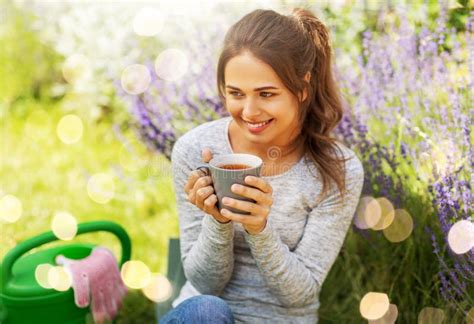 Young Woman Drinking Tea At Summer Garden Stock Image Image Of Happy