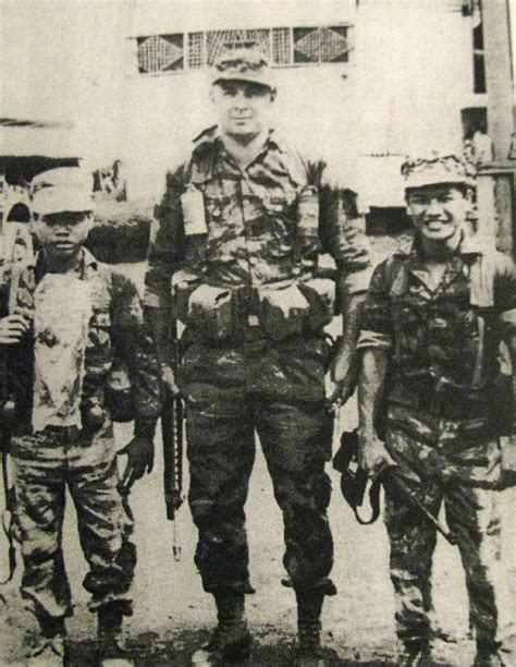 He Towers Over A Couple Of His Montagnard Commandos While Serving In
