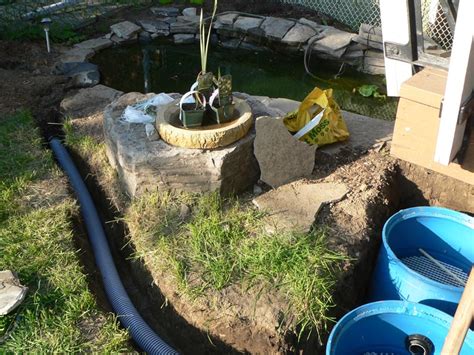 Continuous pond vacuum with power discharge. Clarke Koi Ponds Monthly Pond Photo