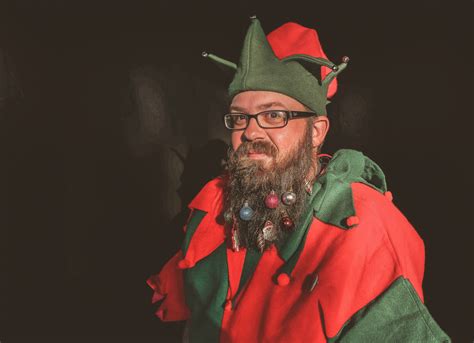 Free Photo Man In Red And Green Elf Costume Adult Indoors