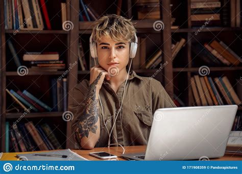 Distance Education Young Woman Short Hair In Headphones Sitting At